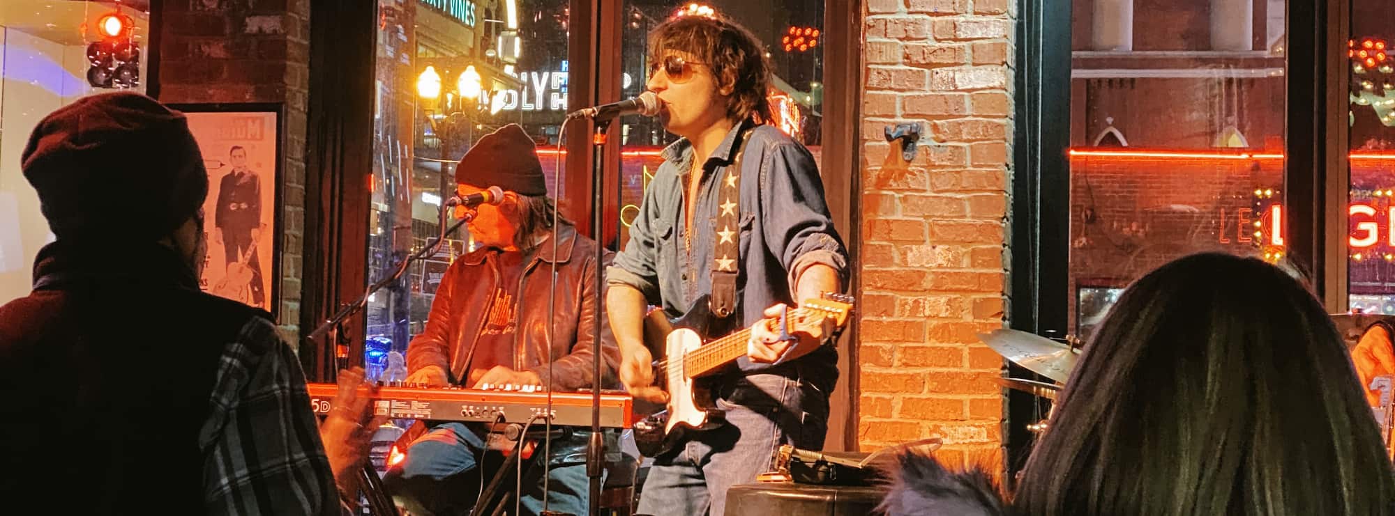 bar singer on guitar in Greensboro